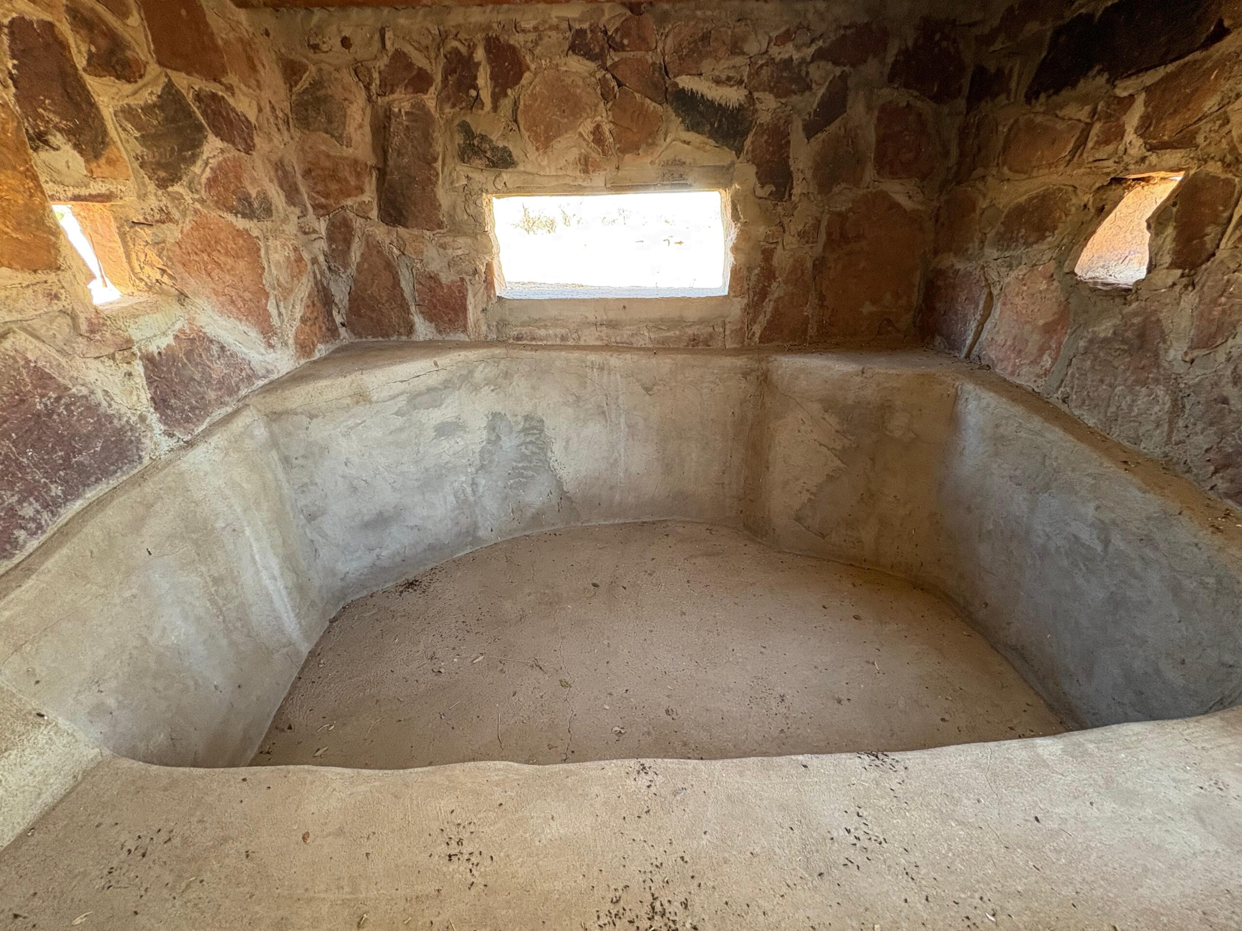 Inside a stone-walled bow hunting blind