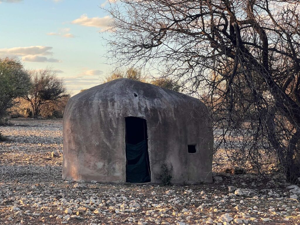 Dome-shaped clay bow hunting blind in the bushveld