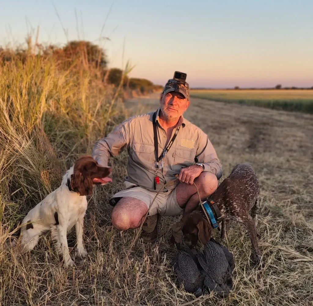 Wingshooter with his pointers after a hunt