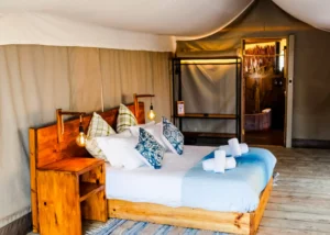 Tented suite with a double bed at the Namibian lodge