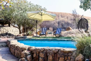 Rock pool with loungers at the Namibian lodge