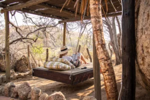 Hammock bed on a shaded deck at the lodge