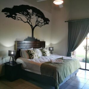 Double bedroom with an acacia tree mural
