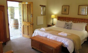 Double bedroom with a door opening onto the garden