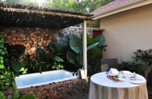 Courtyard plunge pool and table set for breakfast